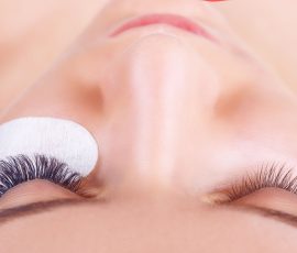 64296104 - eyelash extension procedure. woman eye with long eyelashes. lashes. close up, selected focus.
